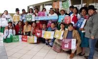 Indigenous Women gather with SDG signs